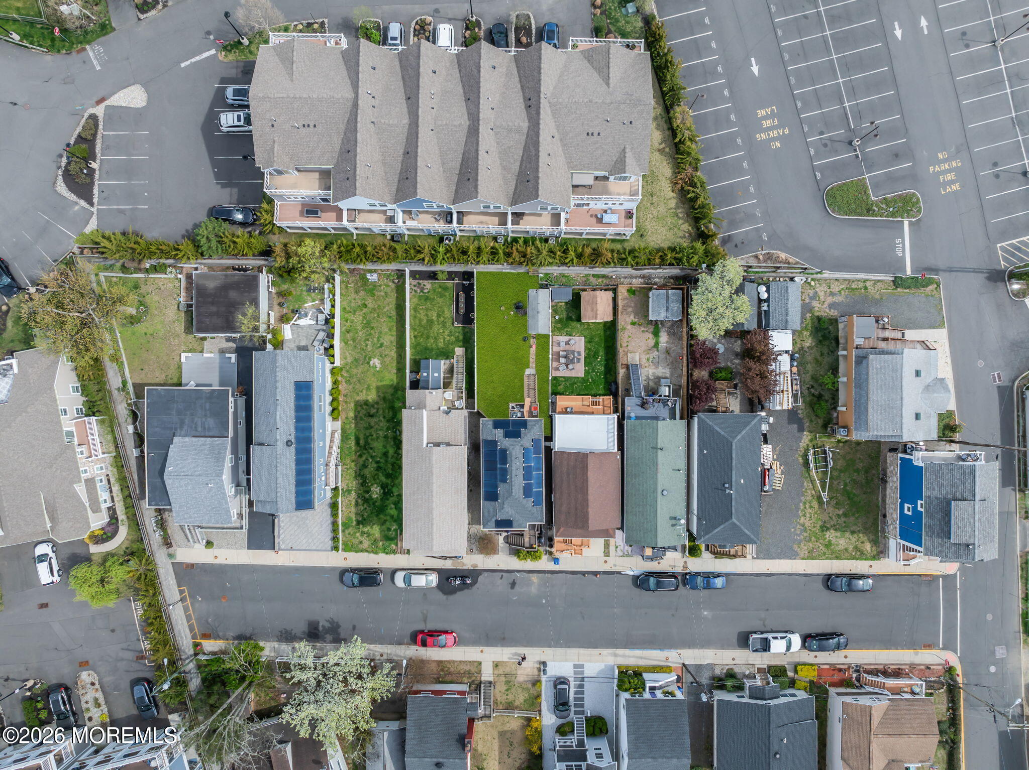 13 Locust Street Highlands, NJ 07732 - Photo 26 of 42 an aerial view of multi story residential apartment building with yard and seating space