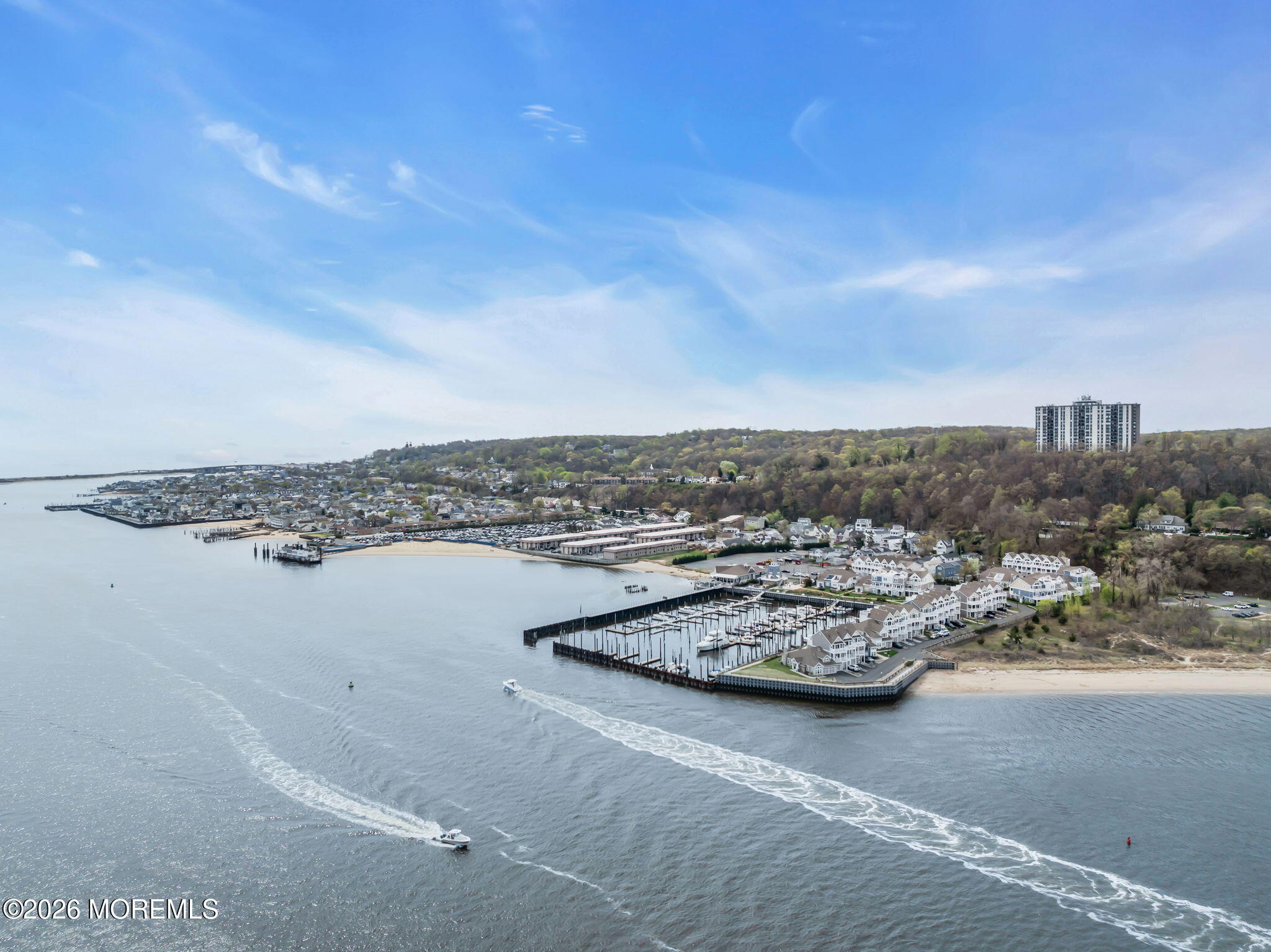13 Locust Street Highlands, NJ 07732 - Photo 32 of 42 a view of a terrace with lawn chairs and ocean view