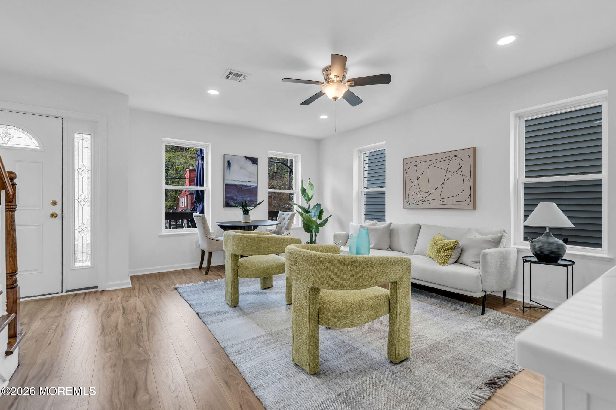 13 Locust Street Highlands, NJ 07732 - Photo 6 of 42 a living room with furniture and a wooden floor