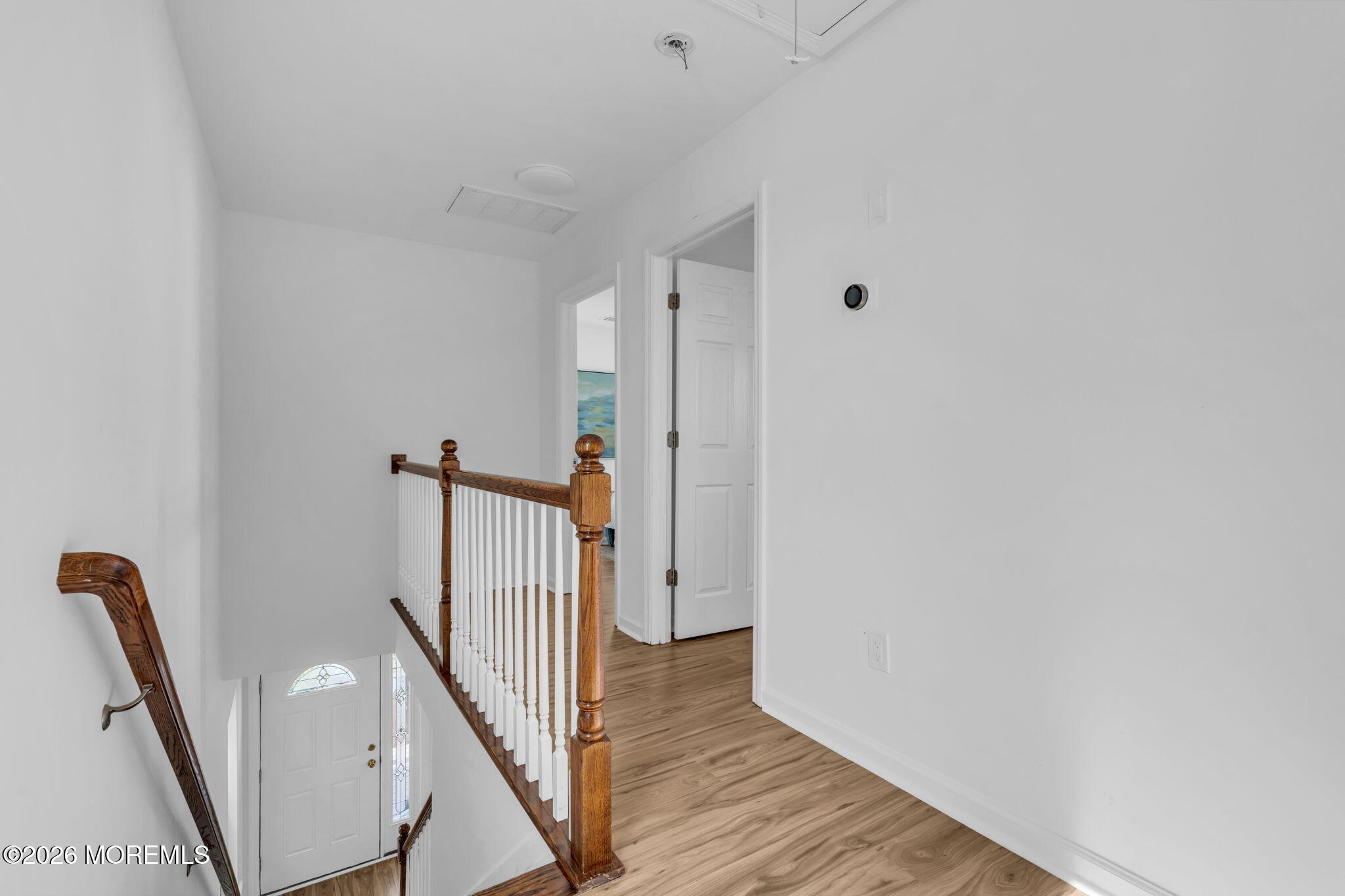13 Locust Street Highlands, NJ 07732 - Photo 10 of 42 a view of a hallway with wooden floor and staircase