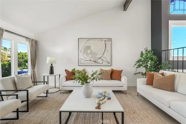 a kitchen with stainless steel appliances a sink cabinets and a window
