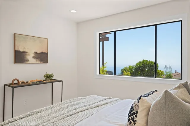 a view of bathroom with a toilet a sink and a mirror
