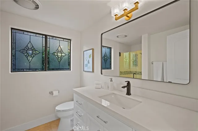 a bedroom with a bed and a desk