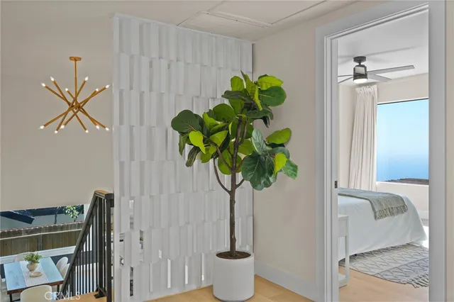 a bedroom with a large bed and a large window