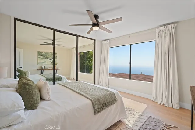 a bathroom with a granite countertop sink a mirror and a shower