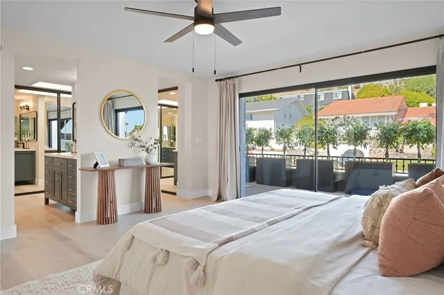 a bedroom with a large bed and a large window