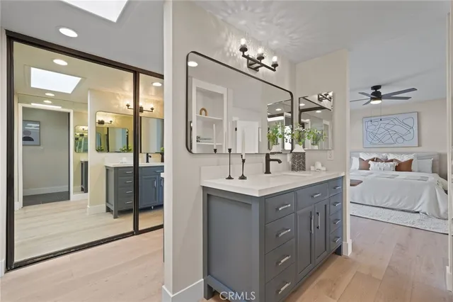 a roof deck with table and chairs and potted plants