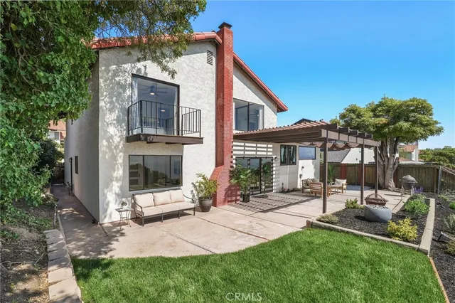 an aerial view of multiple houses with a yard