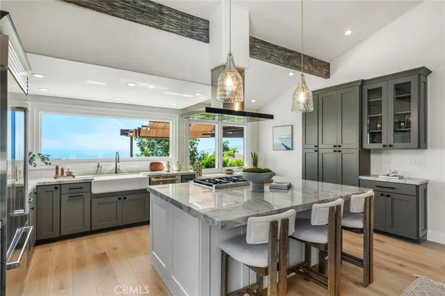 a kitchen with lots of counter top space and dining table