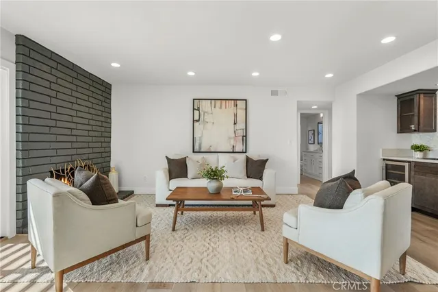 a living room with furniture and a potted plant