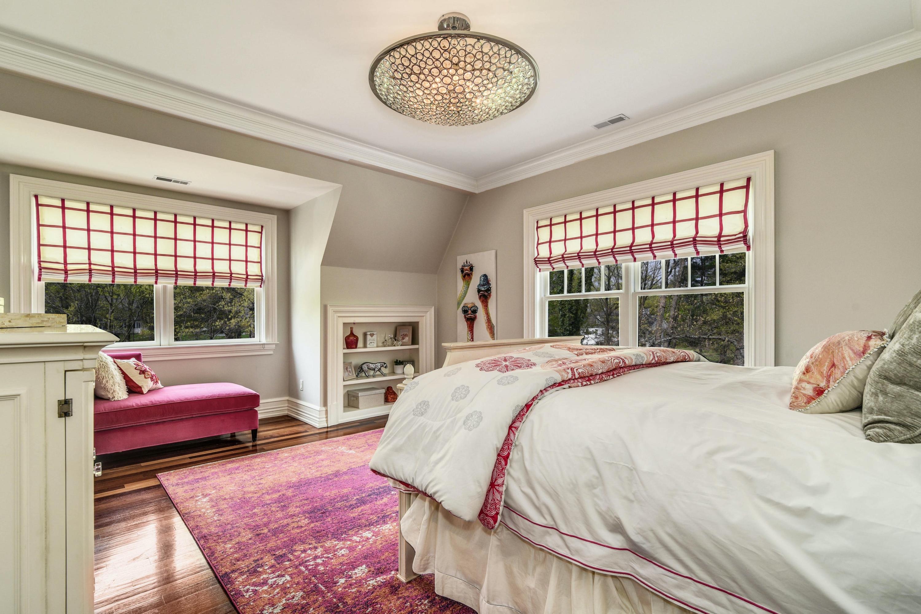 1083 Smith Ridge Road New Canaan, CT 06840 - Photo 22 of 39 a bedroom with a bed mirror and window