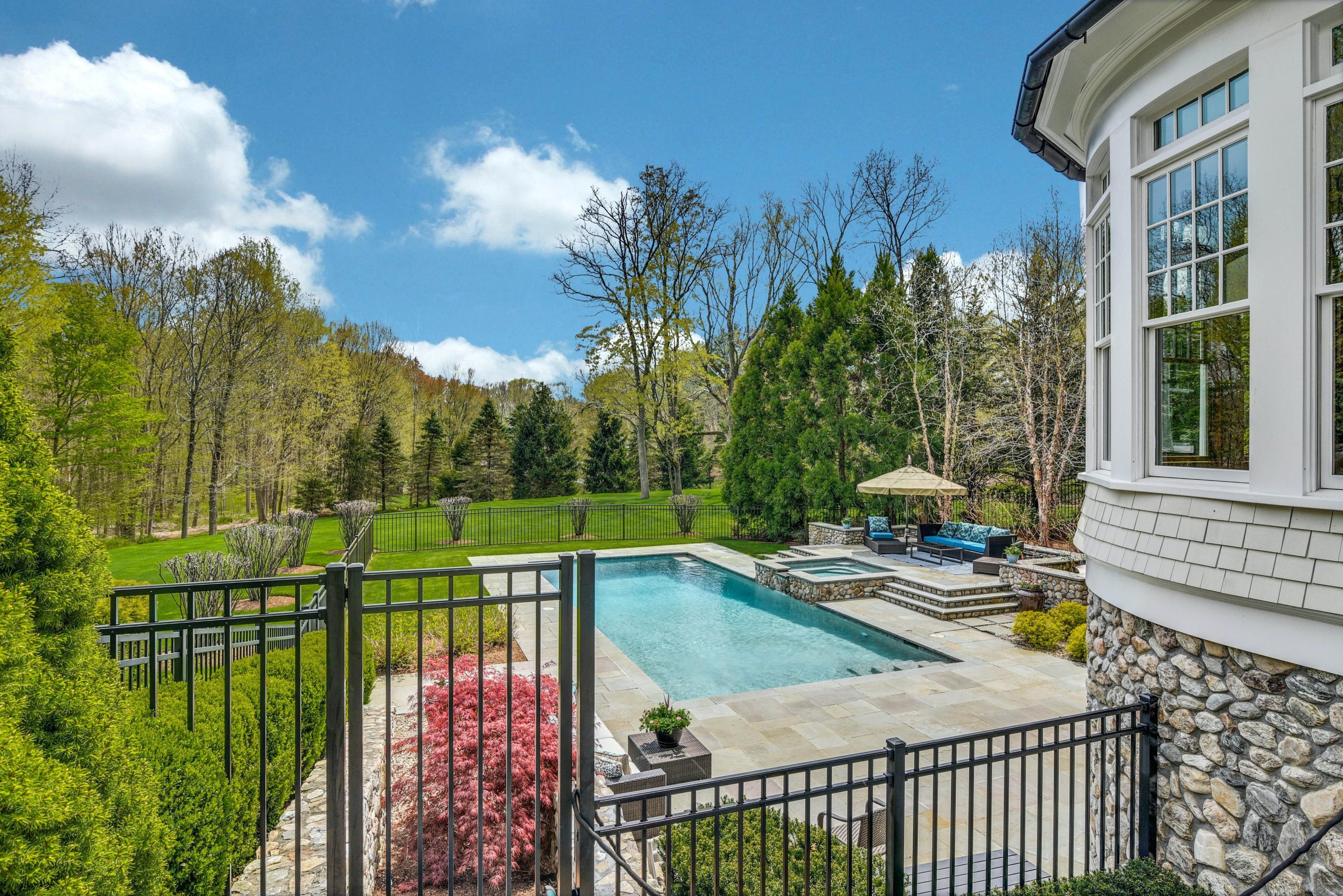 1083 Smith Ridge Road New Canaan, CT 06840 - Photo 34 of 39 a view of a balcony with a swimming pool
