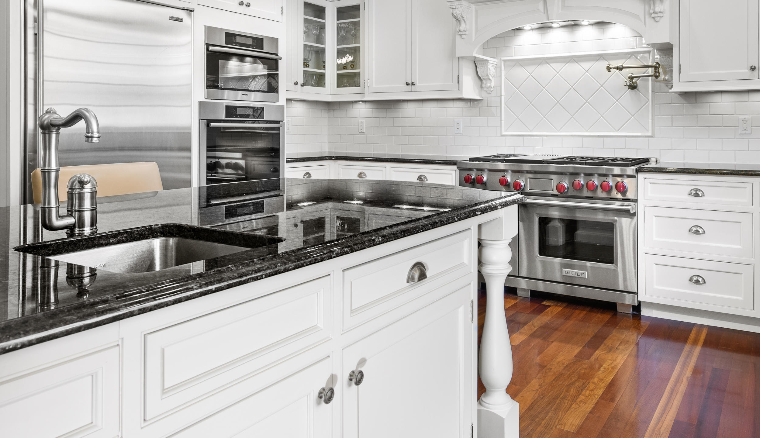 1083 Smith Ridge Road New Canaan, CT 06840 - Photo 8 of 39 a kitchen with cabinets and appliances