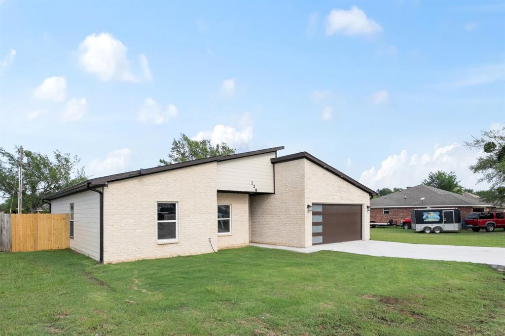 228 Windjammer Road Gun Barrel City, TX 75156 - Photo 2 of 19 a house view with a garden space
