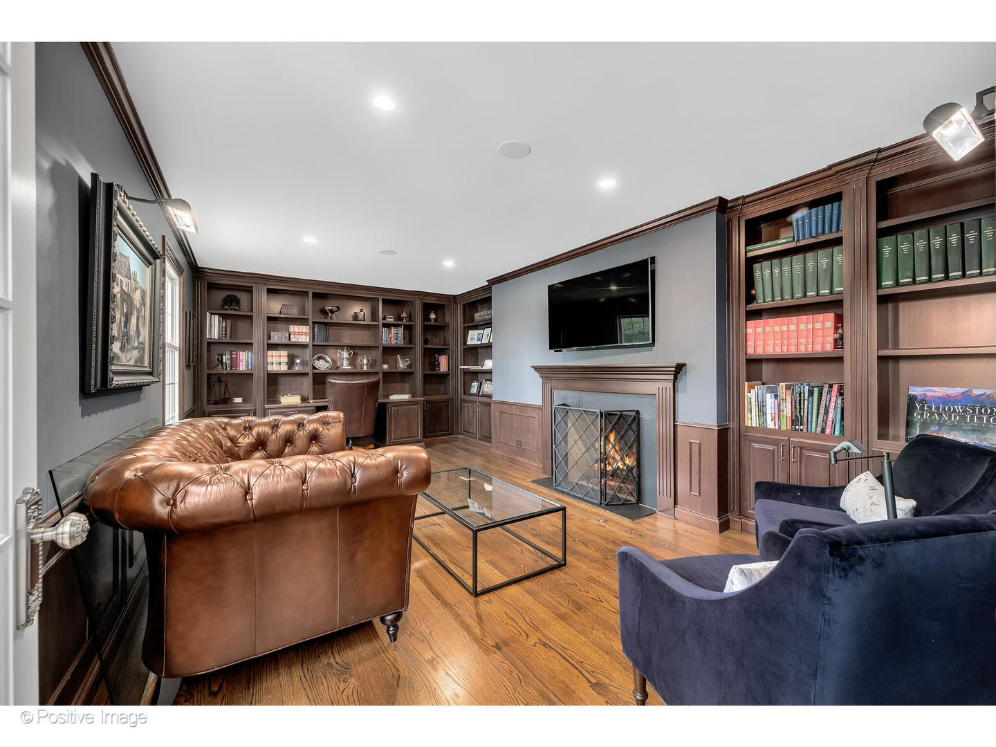 48 Devonshire Drive Oak Brook, IL 60523 - Photo 11 of 59 a living room with fireplace furniture and a flat screen tv
