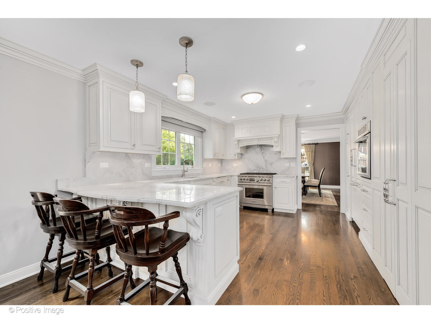 48 Devonshire Drive Oak Brook, IL 60523 - Photo 14 of 59 a kitchen with a table chairs a sink dishwasher window and cabinets