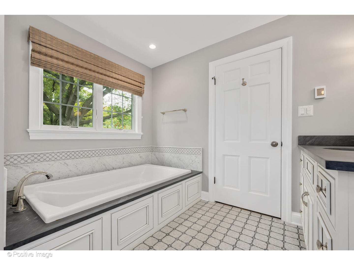 48 Devonshire Drive Oak Brook, IL 60523 - Photo 31 of 59 a bathroom with a sink a vanity and a bathtub