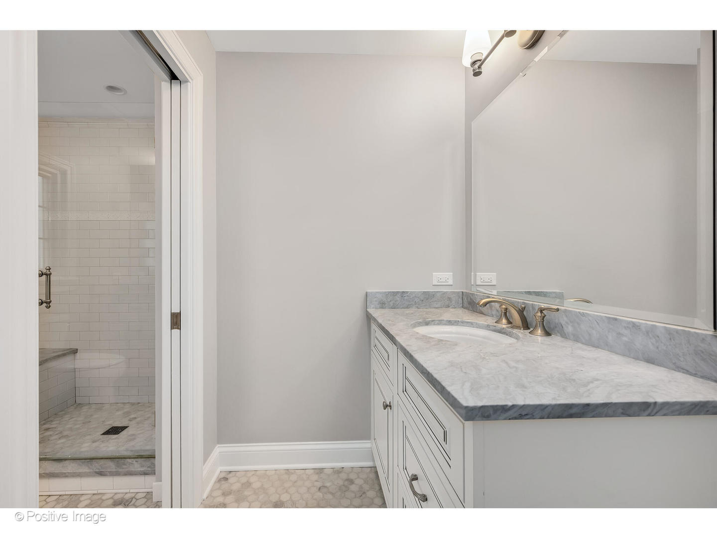 48 Devonshire Drive Oak Brook, IL 60523 - Photo 38 of 59 a bathroom with a granite countertop sink a mirror and shower