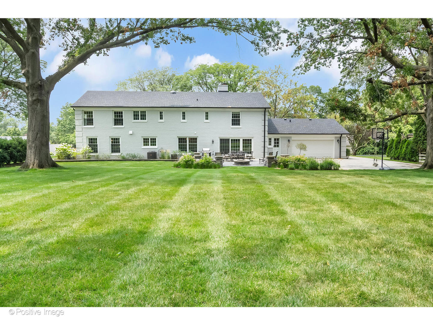 48 Devonshire Drive Oak Brook, IL 60523 - Photo 51 of 59 a view of a house with a big yard and large trees