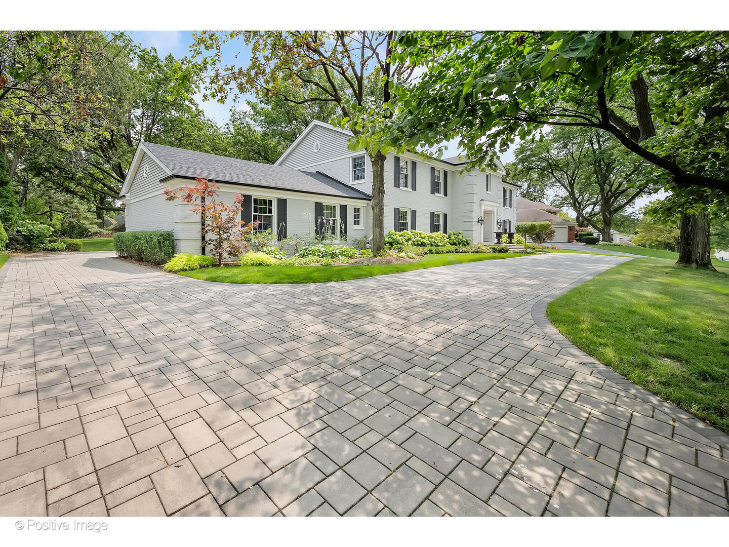 48 Devonshire Drive Oak Brook, IL 60523 - Photo 52 of 59 a front view of a house with garden