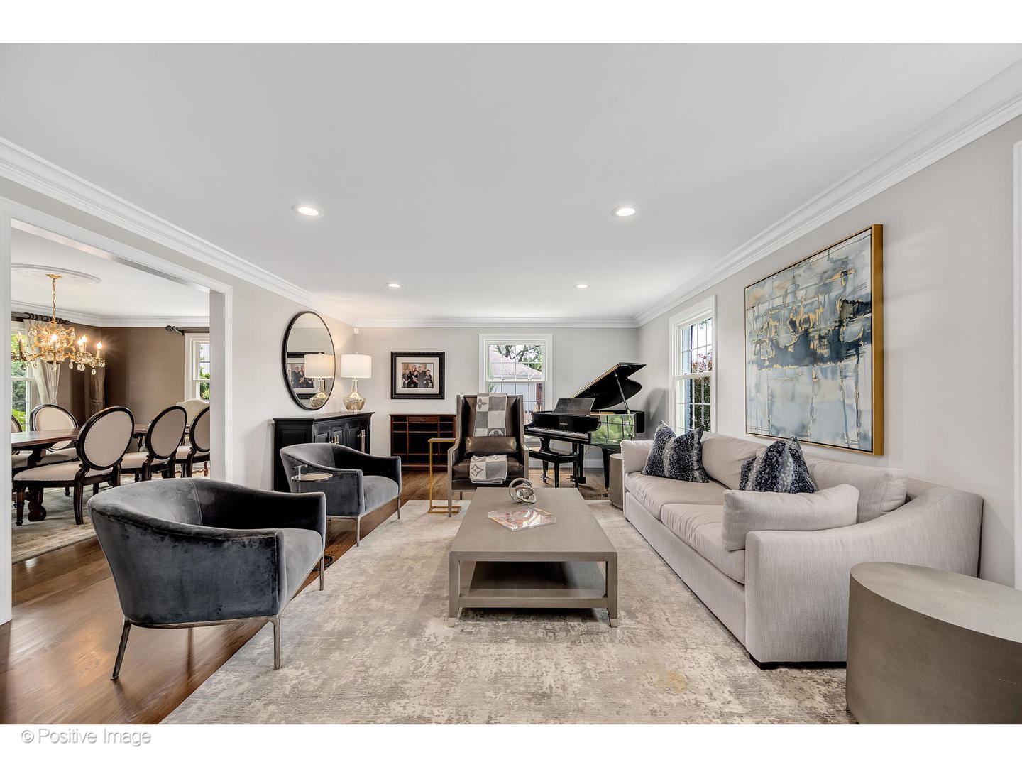 48 Devonshire Drive Oak Brook, IL 60523 - Photo 10 of 59 a living room with furniture a large window and kitchen view