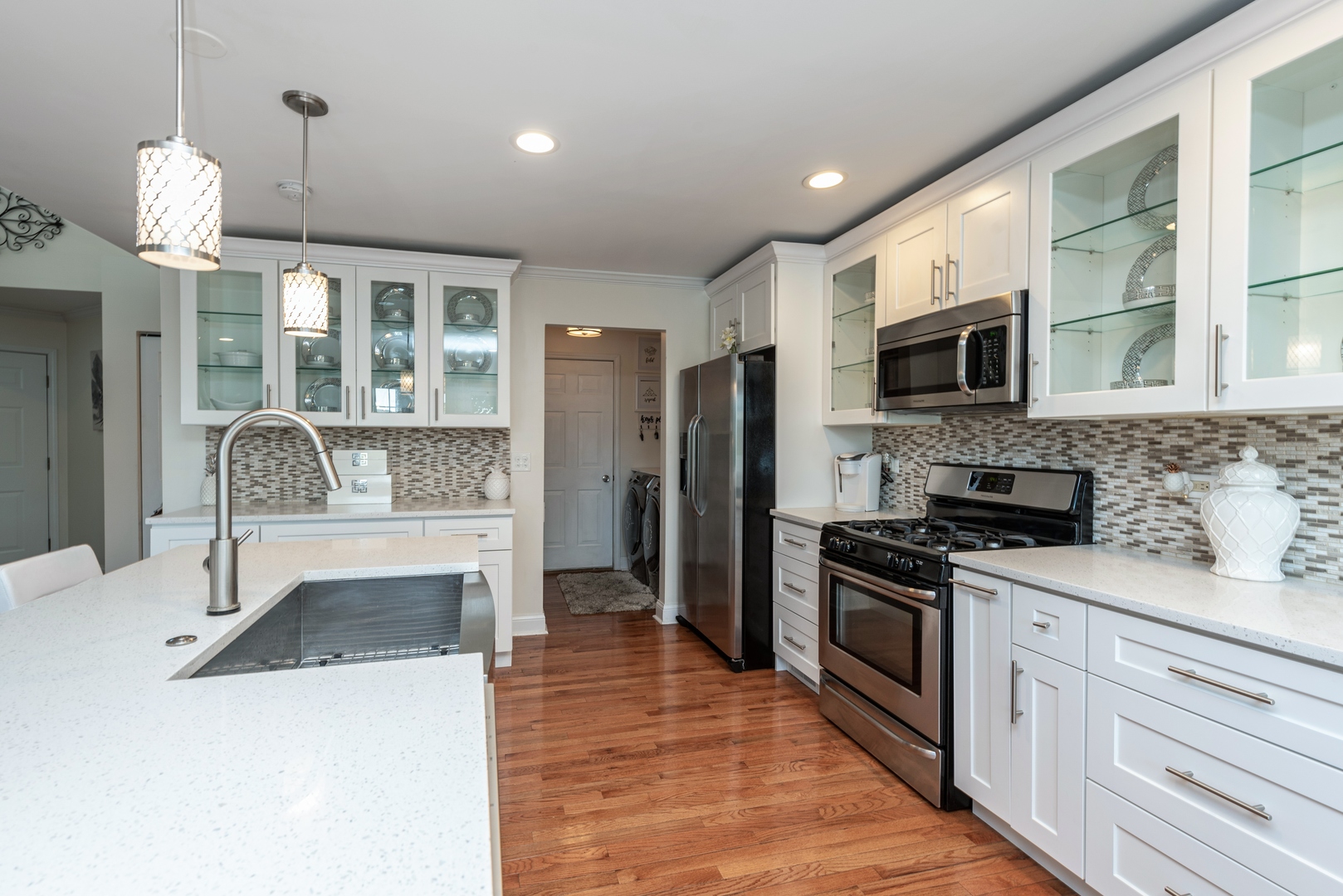10767 Cape Cod Lane Huntley, IL 60142 - Photo 4 of 14 a kitchen with a sink stove and refrigerator