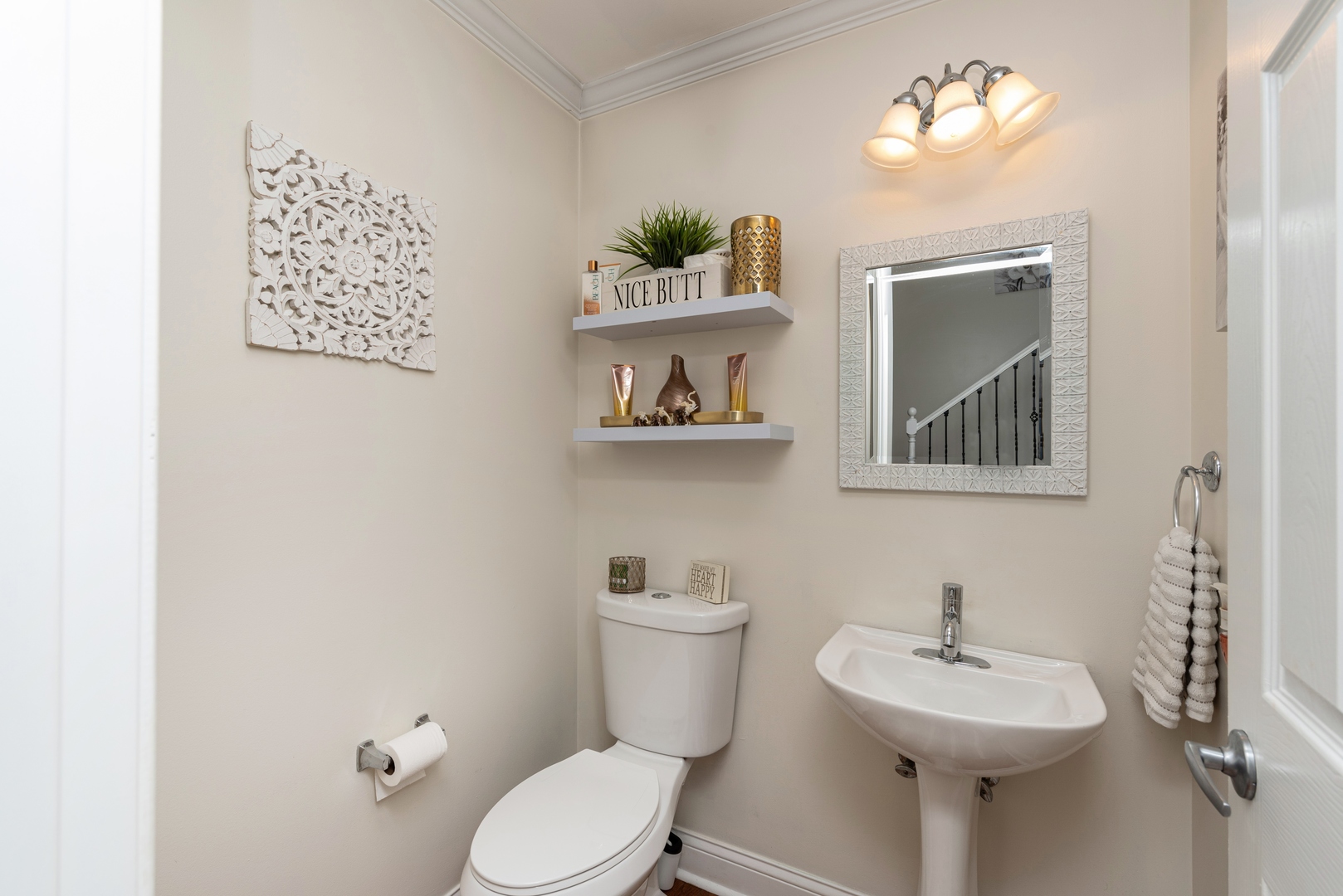 10767 Cape Cod Lane Huntley, IL 60142 - Photo 6 of 14 a bathroom with a toilet a sink and mirror