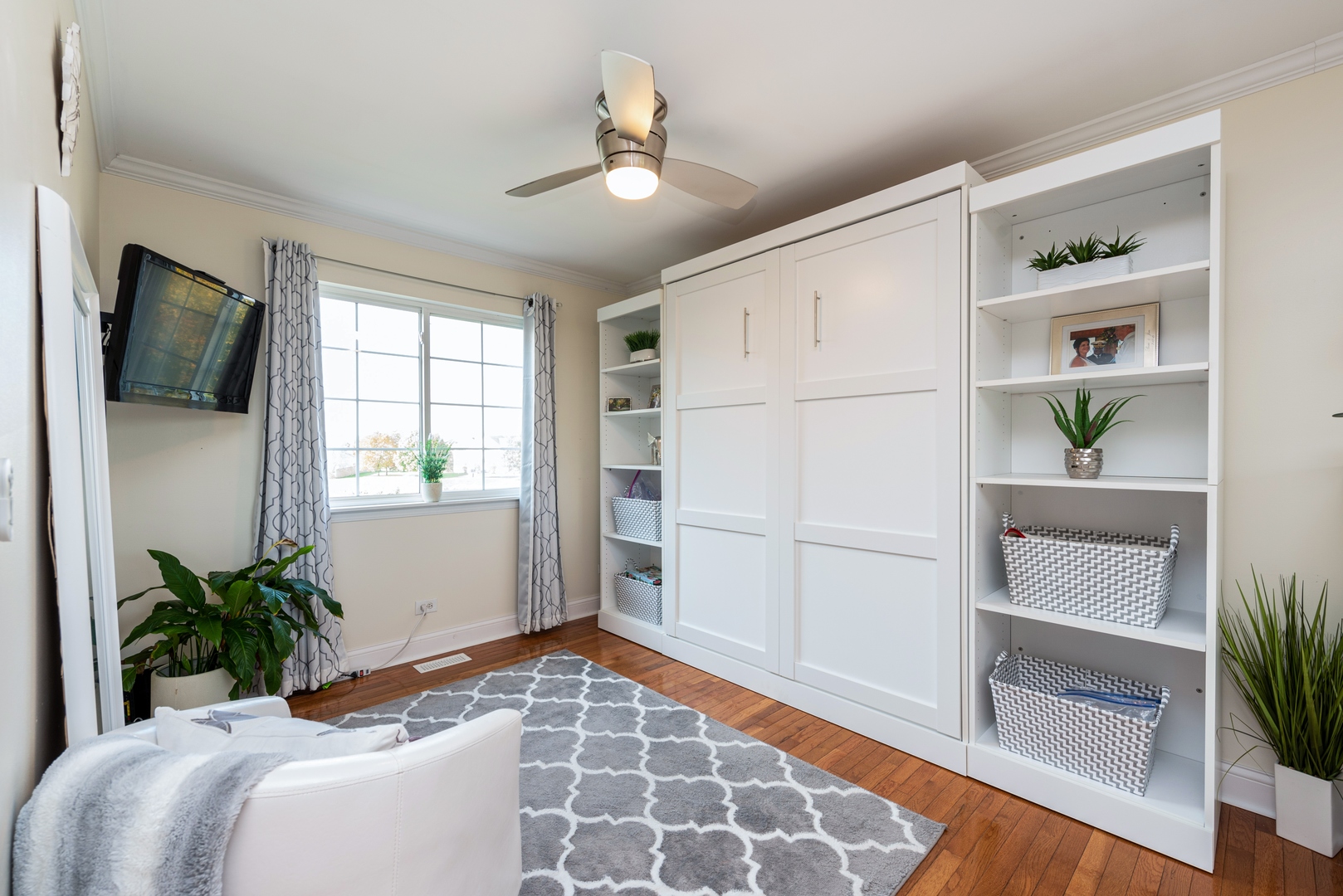 10767 Cape Cod Lane Huntley, IL 60142 - Photo 7 of 14 a bedroom with a bed and a potted plant