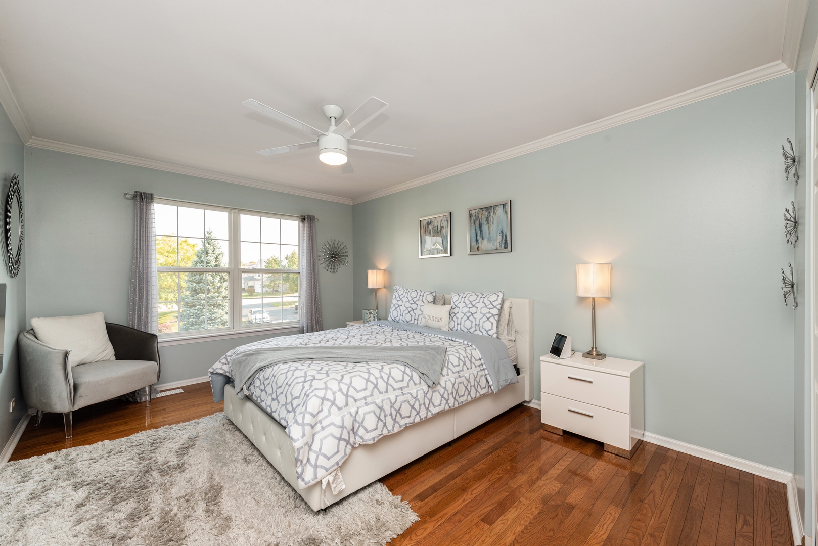 10767 Cape Cod Lane Huntley, IL 60142 - Photo 8 of 14 a bedroom with a bed and a couch