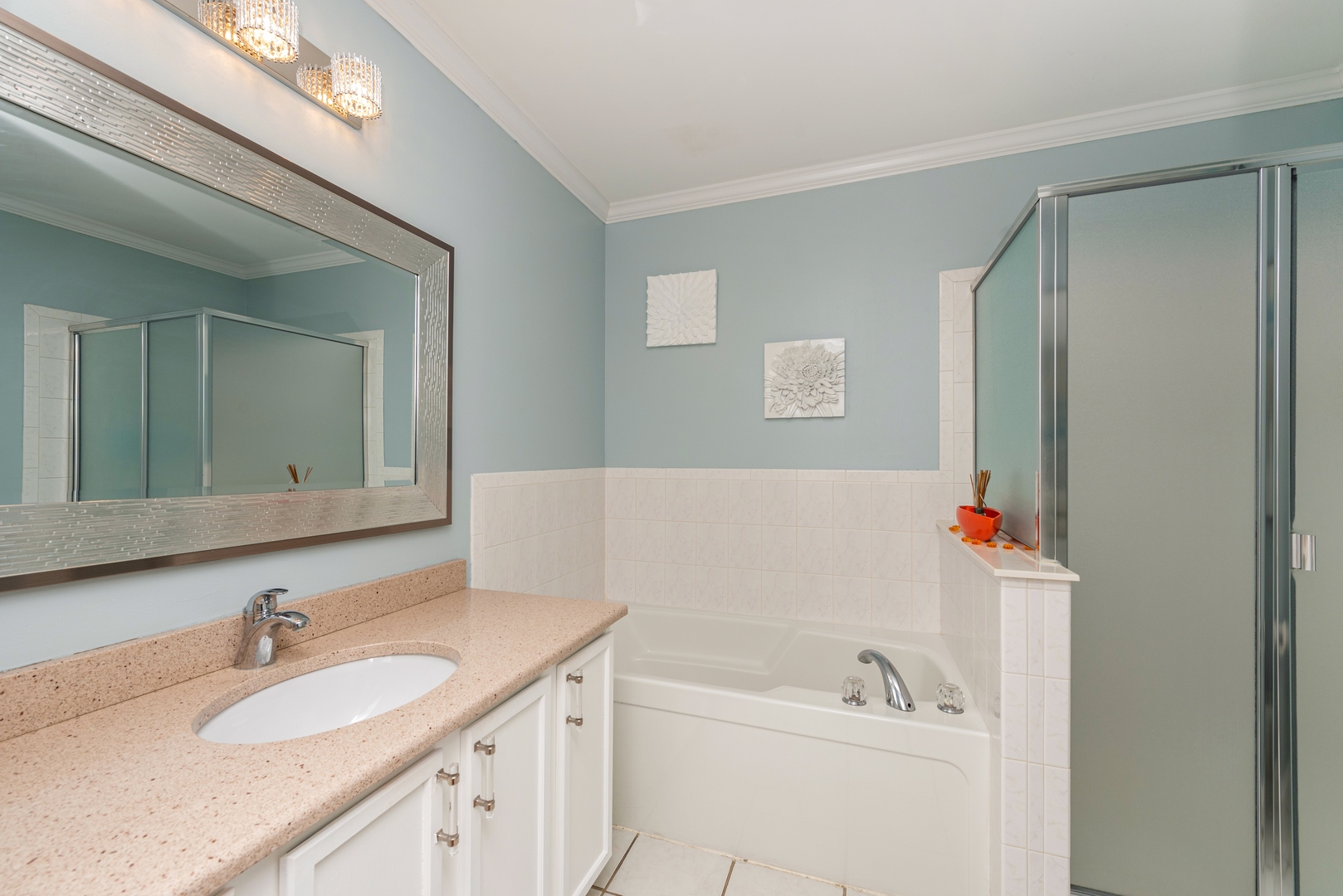 10767 Cape Cod Lane Huntley, IL 60142 - Photo 9 of 14 a bathroom with a sink vanity tub and shower