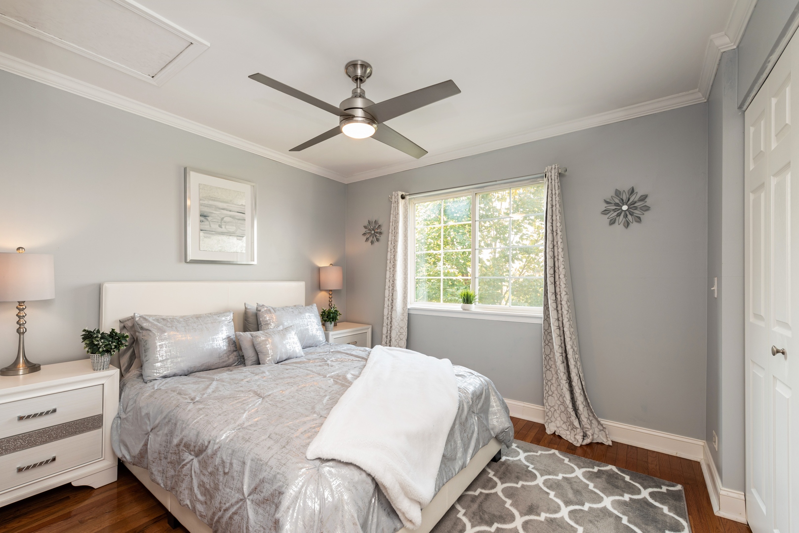 10767 Cape Cod Lane Huntley, IL 60142 - Photo 10 of 14 a bedroom with a large bed and a window