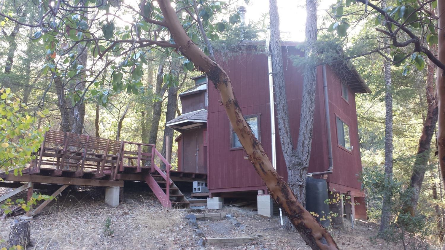 28954 Eel River Ranch Road Covelo, CA 95428 - Photo 1 of 1 a backyard of a house with outdoor seating