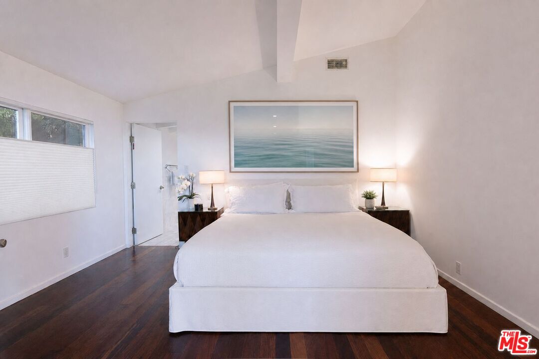 29500 Heathercliff Road, Unit 275 Malibu, CA 90265 - Photo 33 of 35 a bedroom with a bed and a painting on the wall