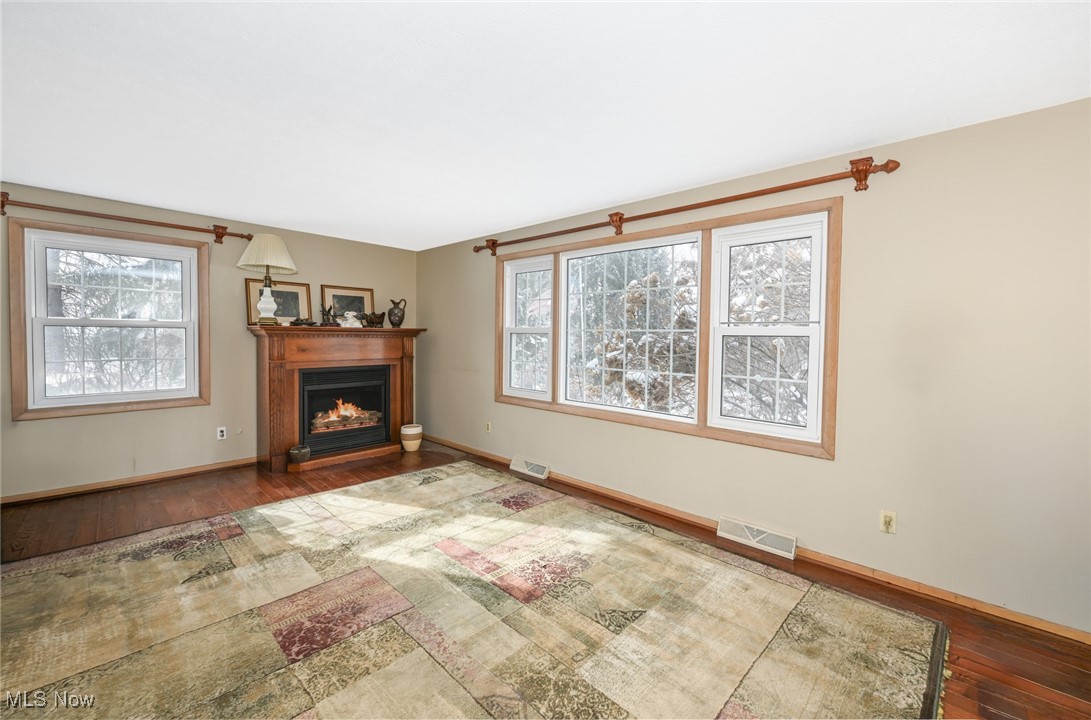 30875 Cannon Road Solon, OH 44139 - Photo 30 of 48 Featuring wood flooring, a fireplace, and plenty of natural light