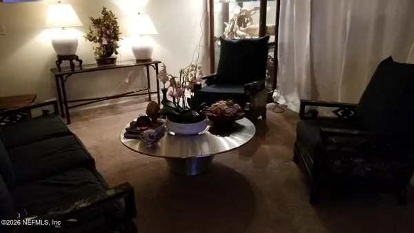 a bedroom with a bed dresser and a window