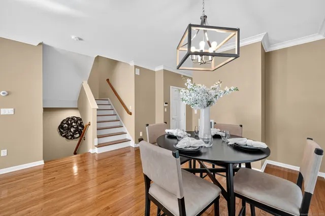 a view of a dining room with furniture and wooden floor
