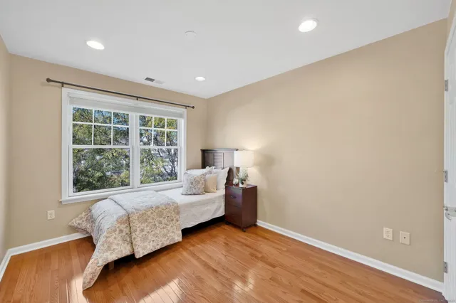 a bed room with a bed and a window