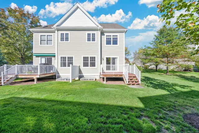 a view of house with a yard