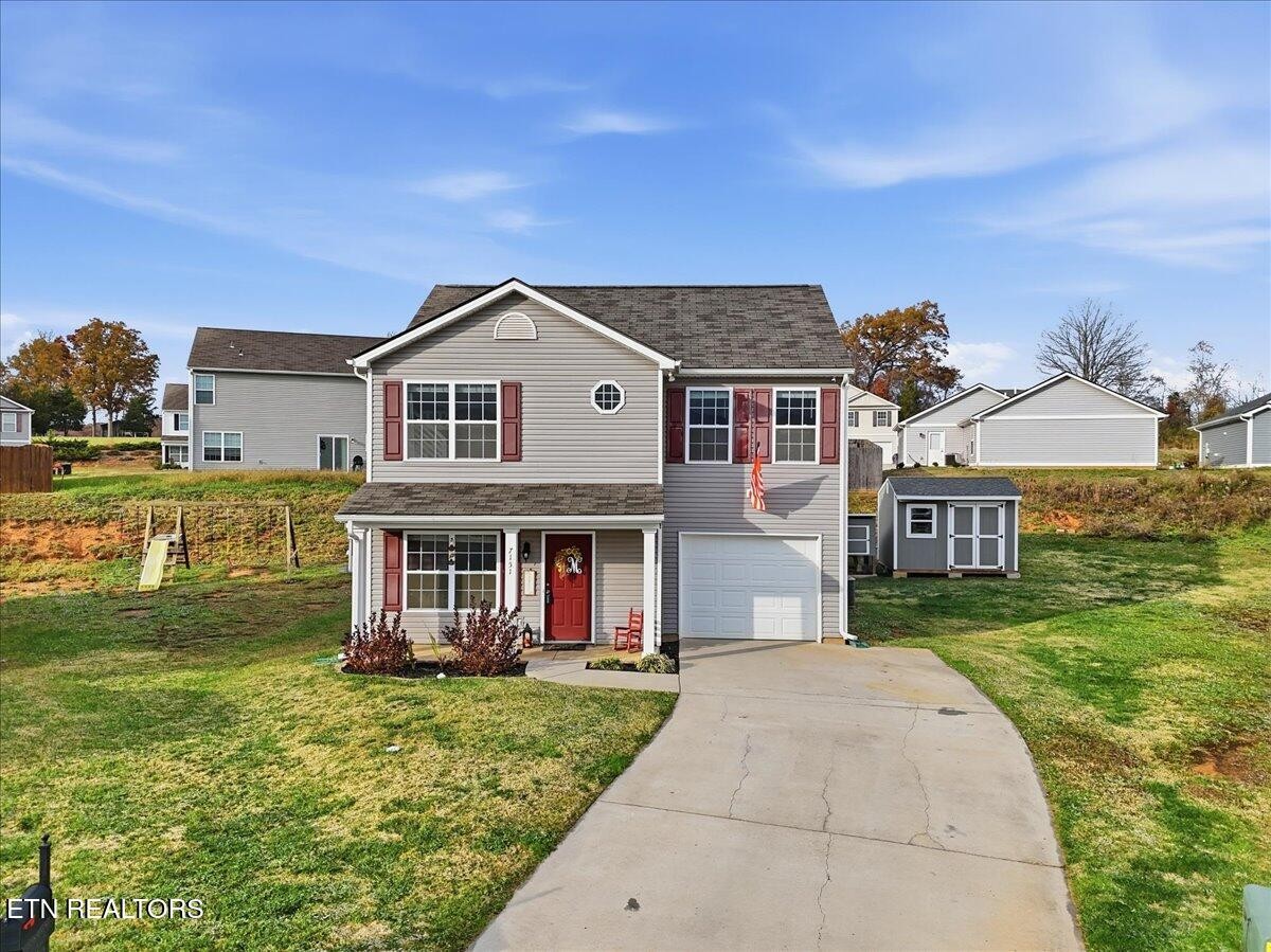 front view of a house with a yard