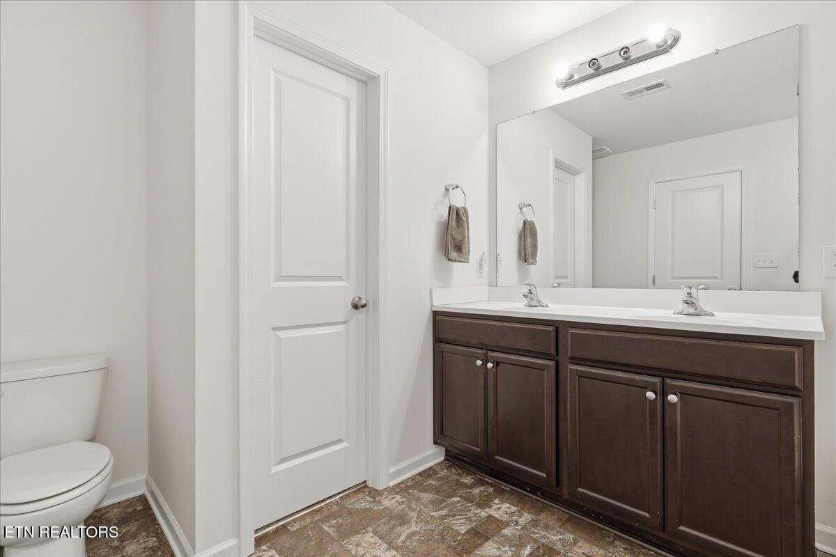 7151 Forest Willow Lane Corryton, TN 37721 - Photo 16 of 24 a bathroom with a sink and a toilet