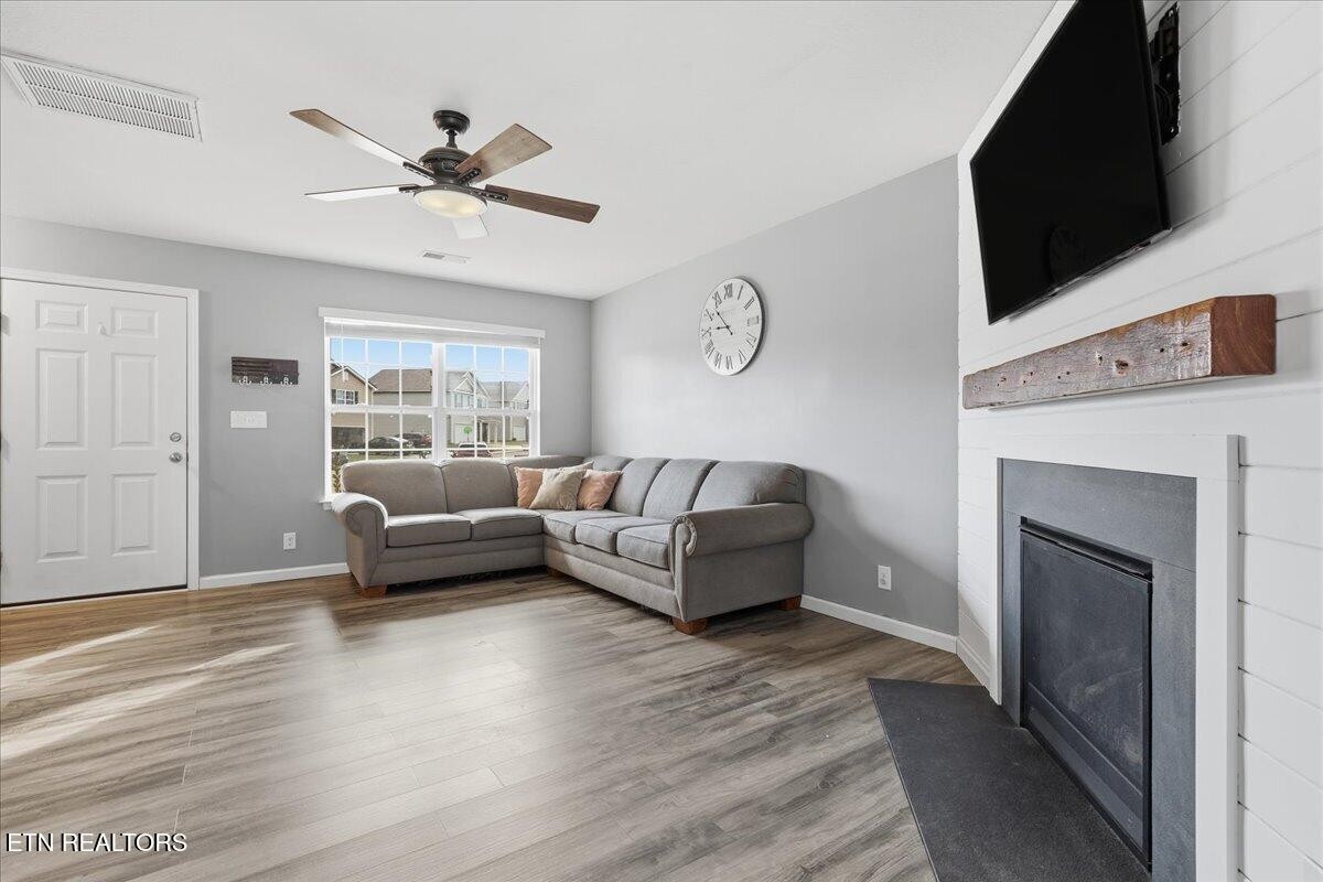 7151 Forest Willow Lane Corryton, TN 37721 - Photo 6 of 24 a living room with furniture and a fireplace
