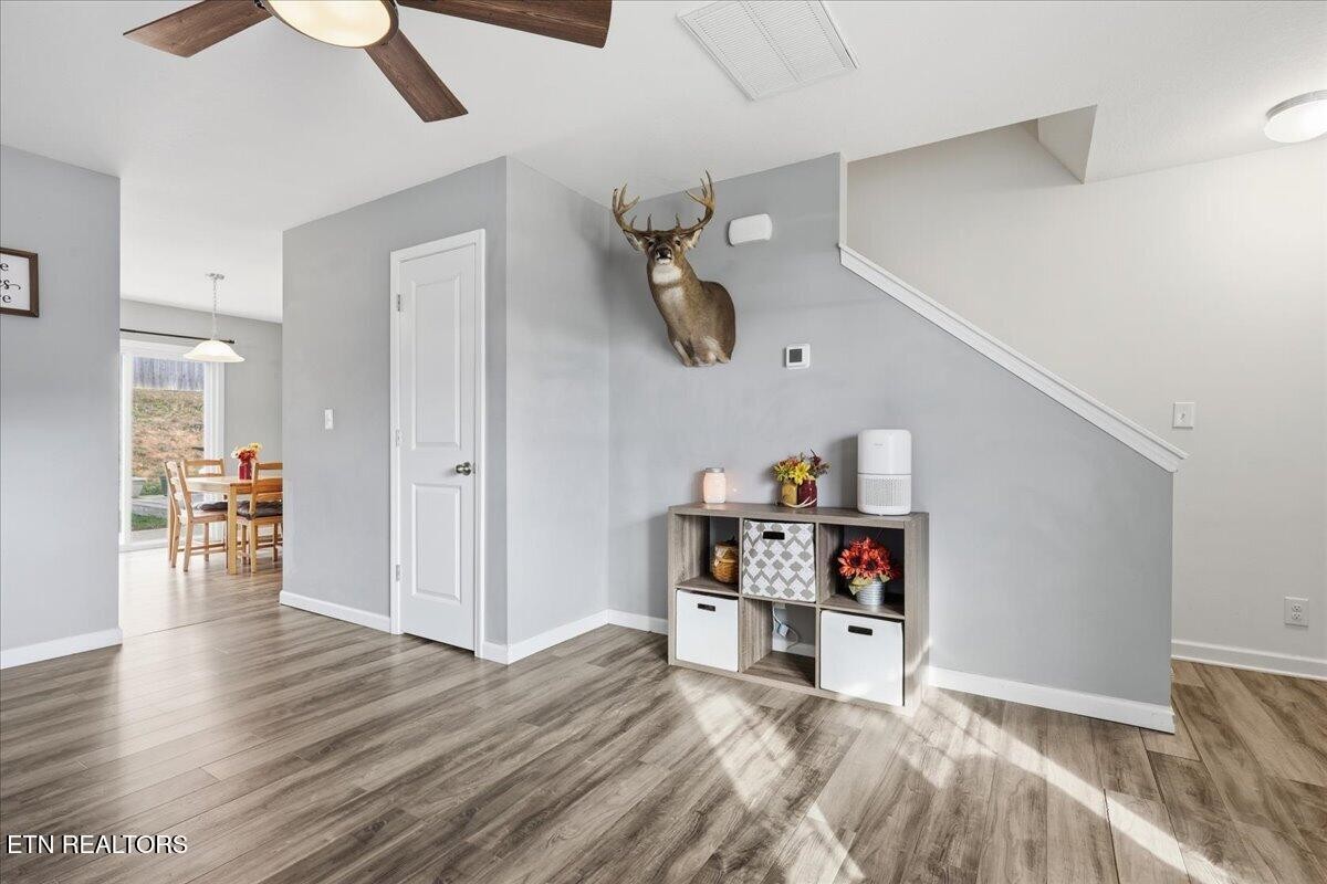 7151 Forest Willow Lane Corryton, TN 37721 - Photo 7 of 24 a living room with furniture and a wooden floor