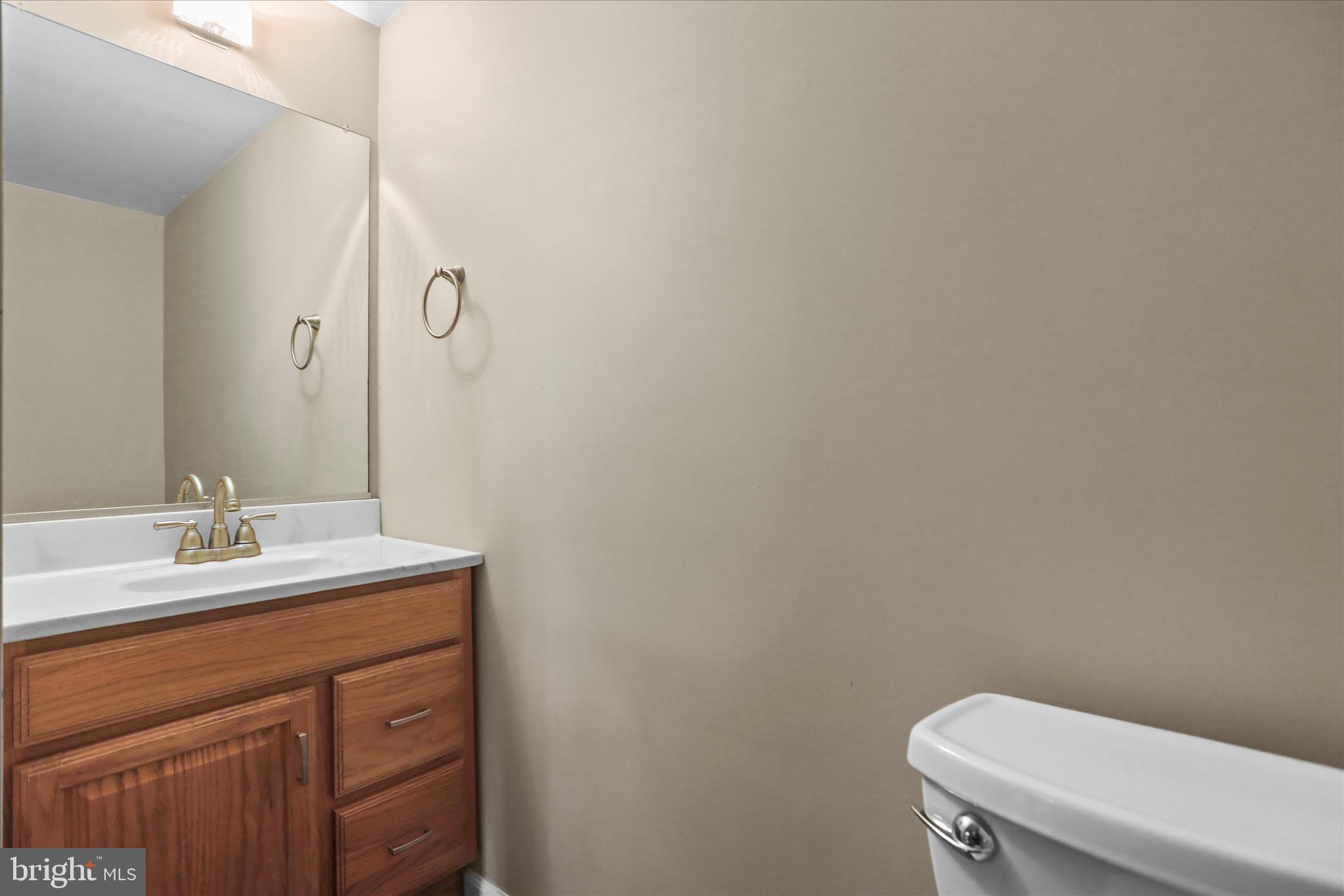 88 Sunset Drive Hanover, PA 17331 - Photo 34 of 51 a bathroom with a sink a toilet and a mirror