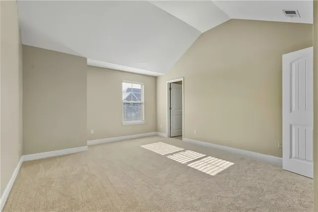 a view of an empty room with windows