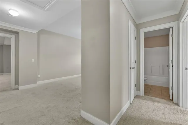 an empty room that has a mirror