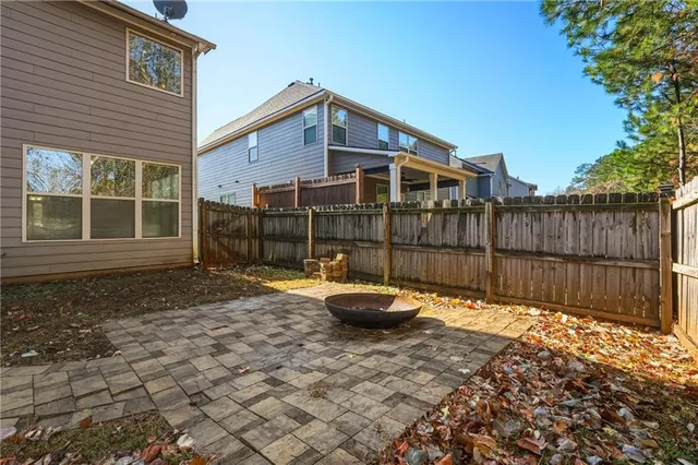 a front view of a house with glass top table and chairs