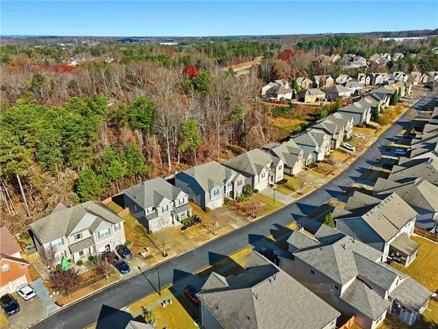 an aerial view of a house with a ocean view
