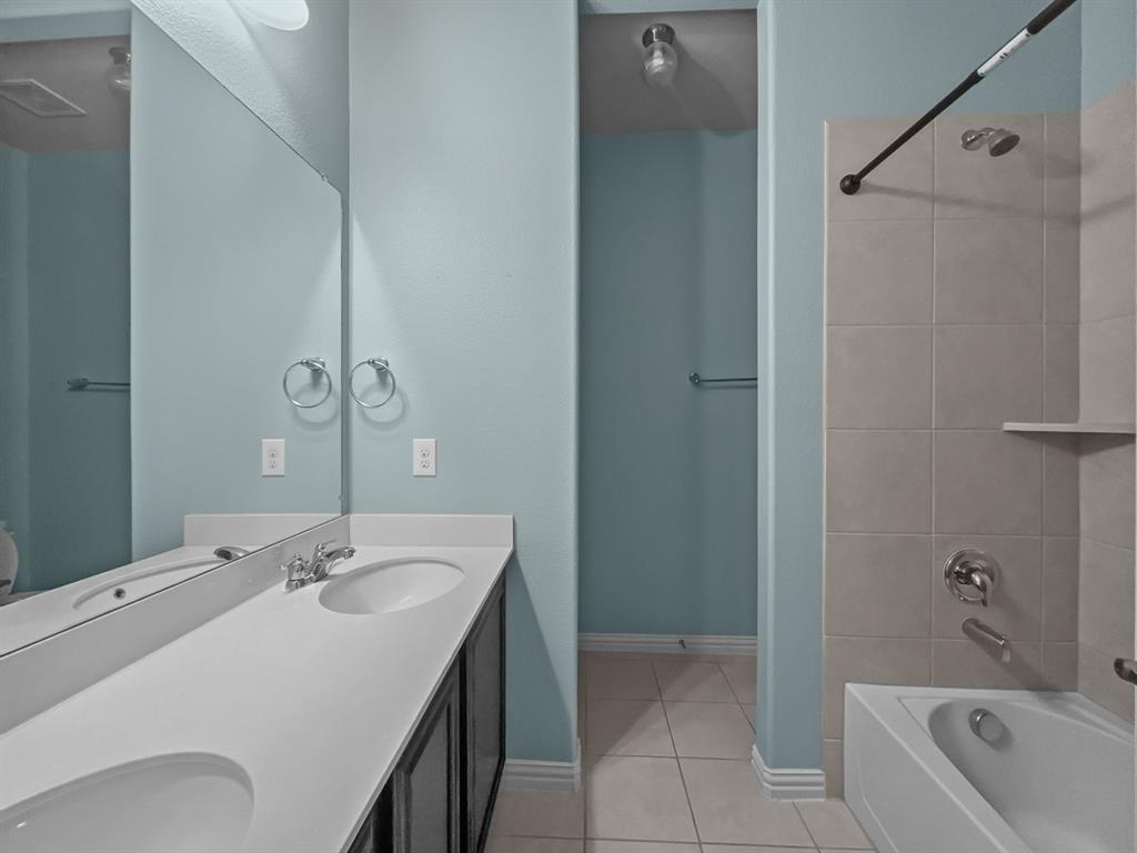 3205 Ridgeway Drive McKinney, TX 75071 - Photo 13 of 27 a bathroom with a tub sink and mirror