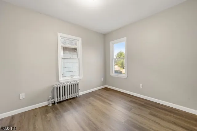 wooden floor and window in an empty room