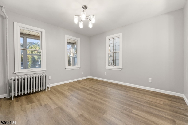 829 South 2nd Street Plainfield, NJ 07063 - Photo 7 of 23 a view of an empty room with wooden floor and a window